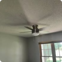 Ceiling fan and light installed in a room