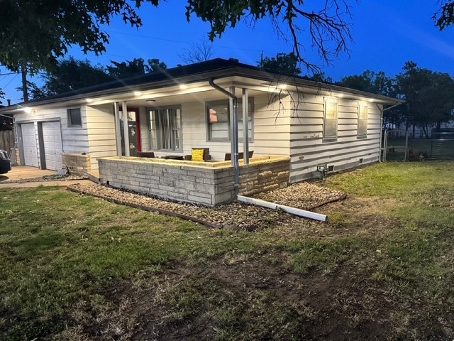 Home exterior and front porch in evening light
